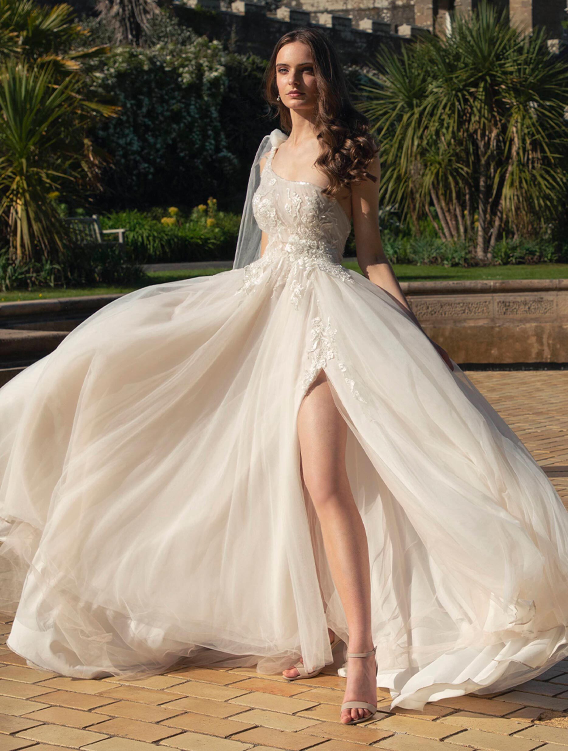Model wearing a white Noya by Riki Dalal Dress in Glasgow, UK