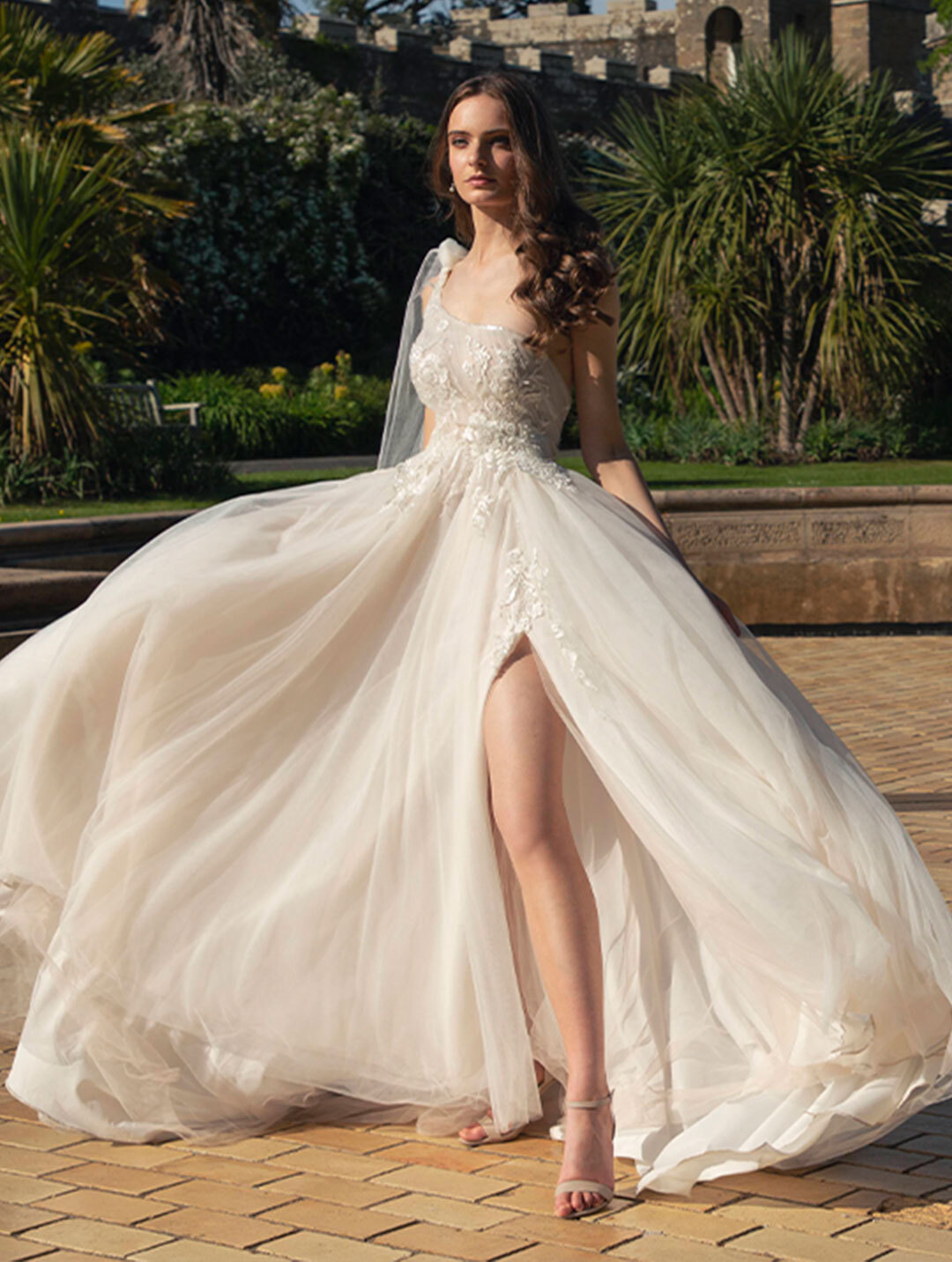 Model wearing a white Noya by Riki Dalal Dress in Glasgow, UK