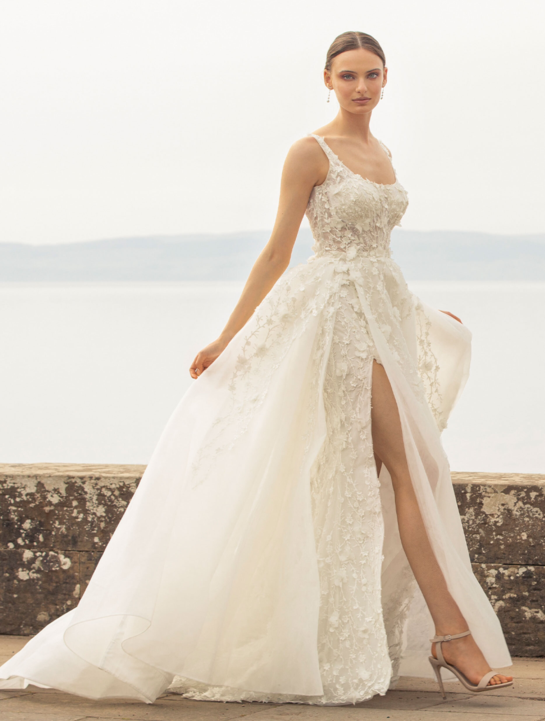 Model wearing a white Noya by Riki Dalal Dress in Glasgow, UK