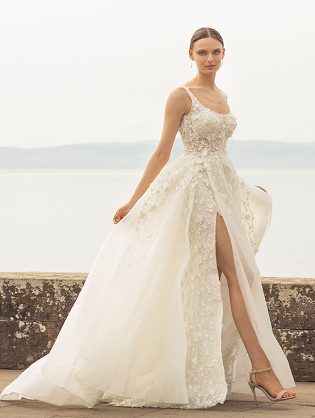 Model wearing a white Noya by Riki Dalal Dress in Glasgow, UK